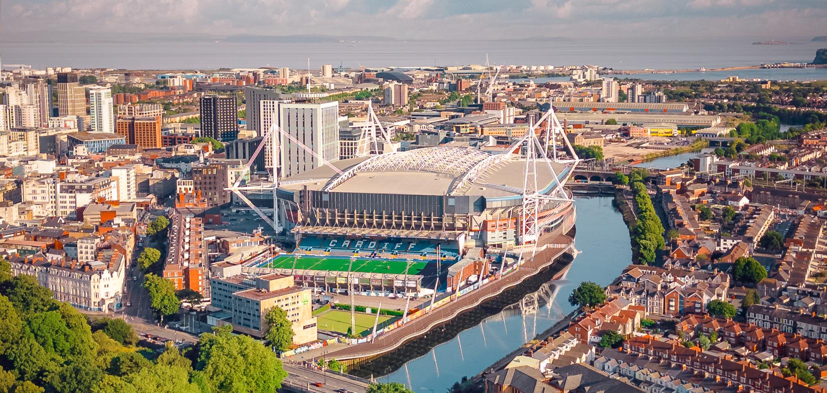 a picture of cardiff's river and the principality stadium