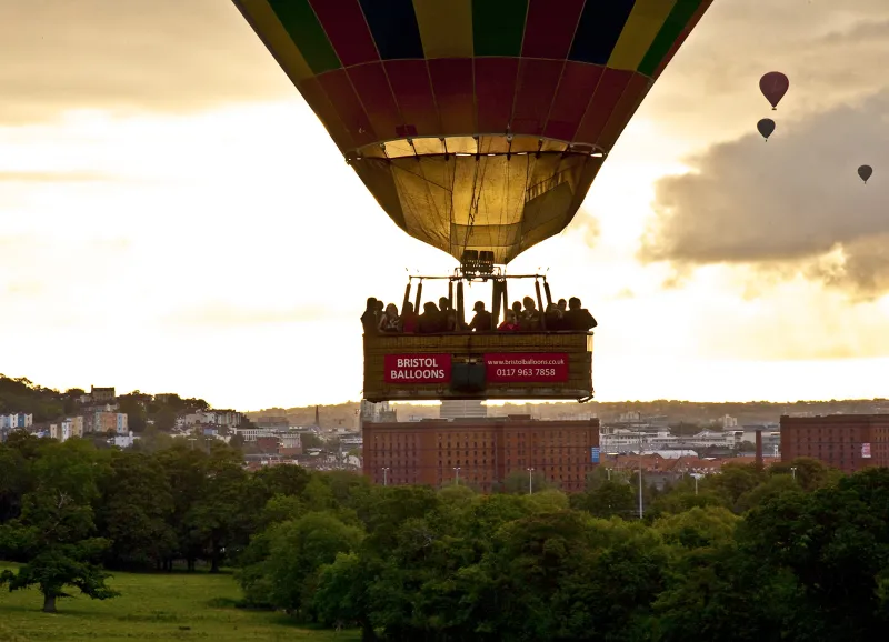 A balloon rising into the sky