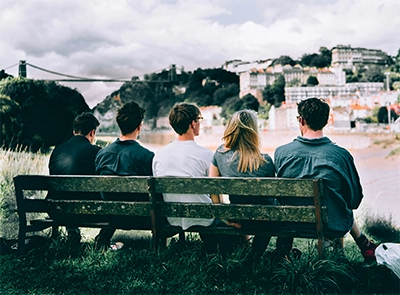 People sat on a bench admiring the view